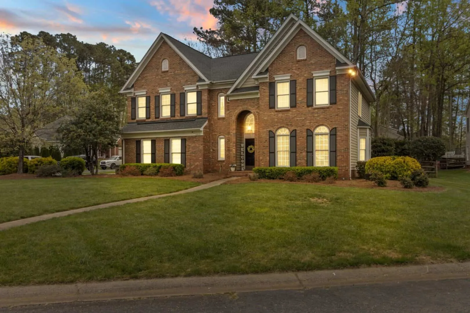 Twilight exterior photo of a colonial home